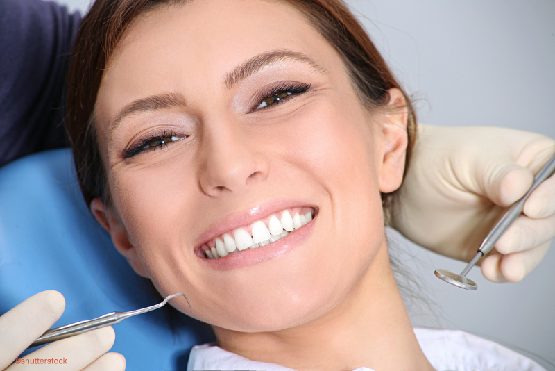 woman smiling during a dental exam