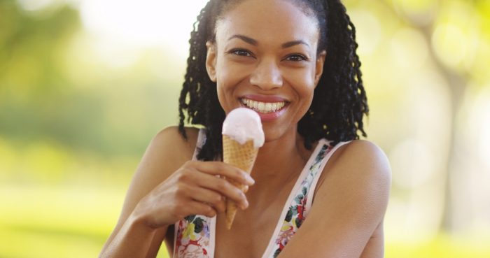 Woman eating ice cream without tooth pain