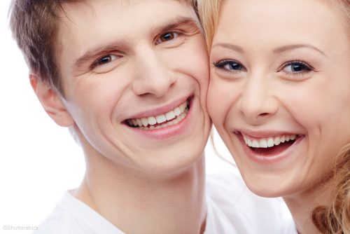 two people smiling after dental bondings