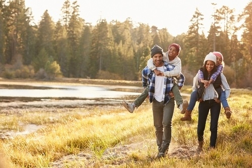 family of four in the outdoors in autumn