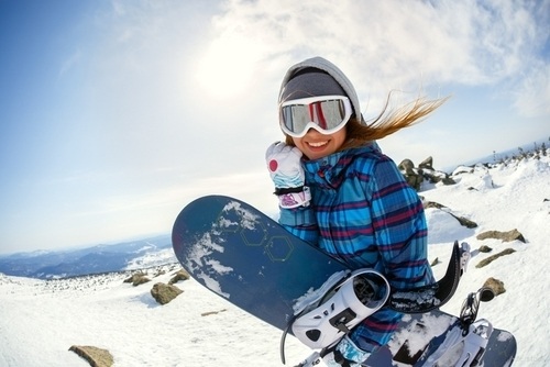 Woman snowboarding