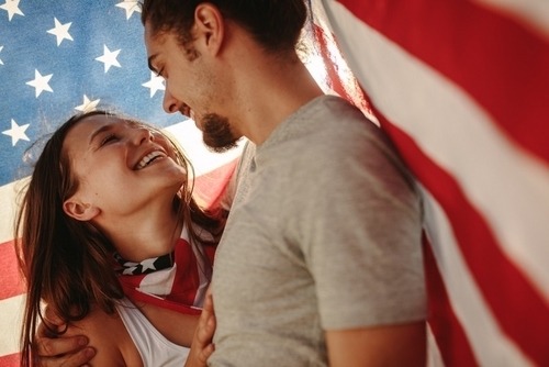 Couple Wrapped in American Flag