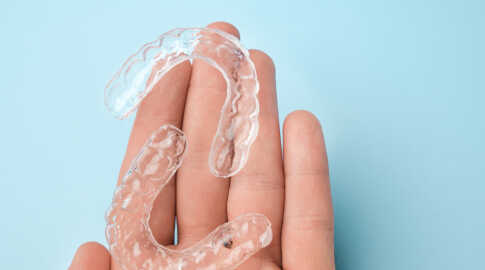 Clear Aligners in Hand - Orthodontist Near Me